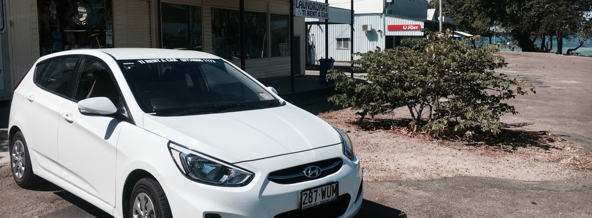 car in front of a shop